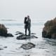 Couple near ocean getting married overseas